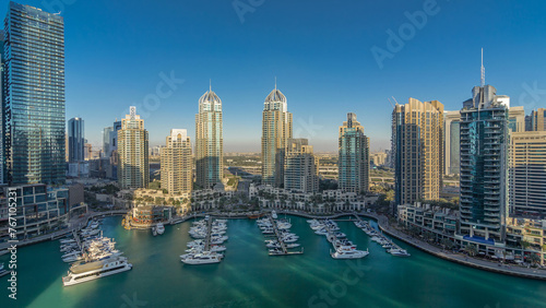 Dubai Marina skyscrapers aerial timelapse, port with luxury yachts and marina promenade