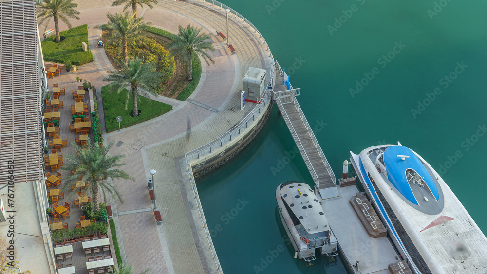 Modern embankment timelapse with bar, Cafe and Restaurant in famous Dubai Marina.