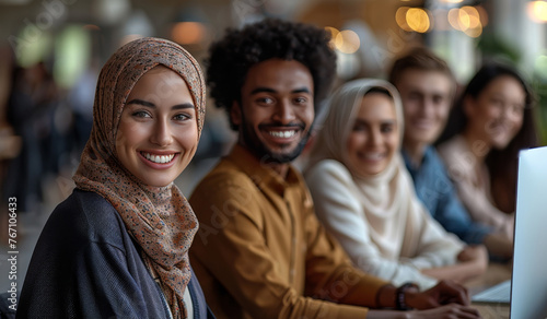 A group of people wearing head scarves are smiling and posing for a picture photo