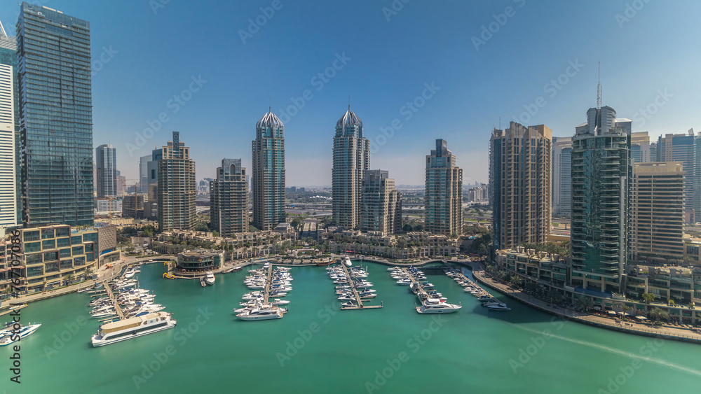 Dubai Marina skyscrapers aerial all day timelapse, port with luxury yachts and marina promenade Dubai Marina skyscrapers aerial all day timelapse, port with luxury yachts and marina promenade