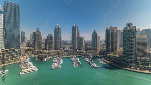 Dubai Marina skyscrapers aerial all day timelapse, port with luxury yachts and marina promenade © neiezhmakov