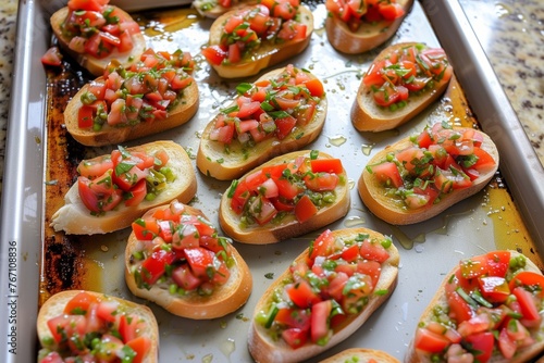 overhead view of tray with prepped bruschetta toasts