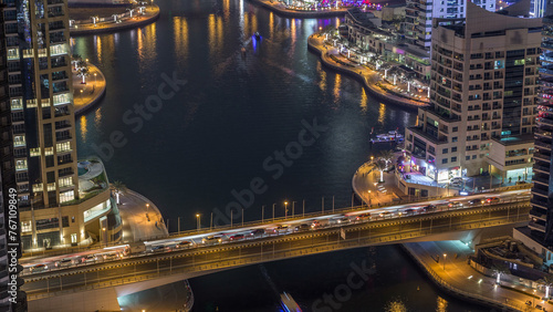 Water canal on Dubai Marina skyline at night timelapse. © neiezhmakov