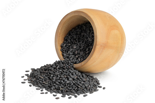 black sesame seeds in wooden bowl isolated on white background with full depth of field