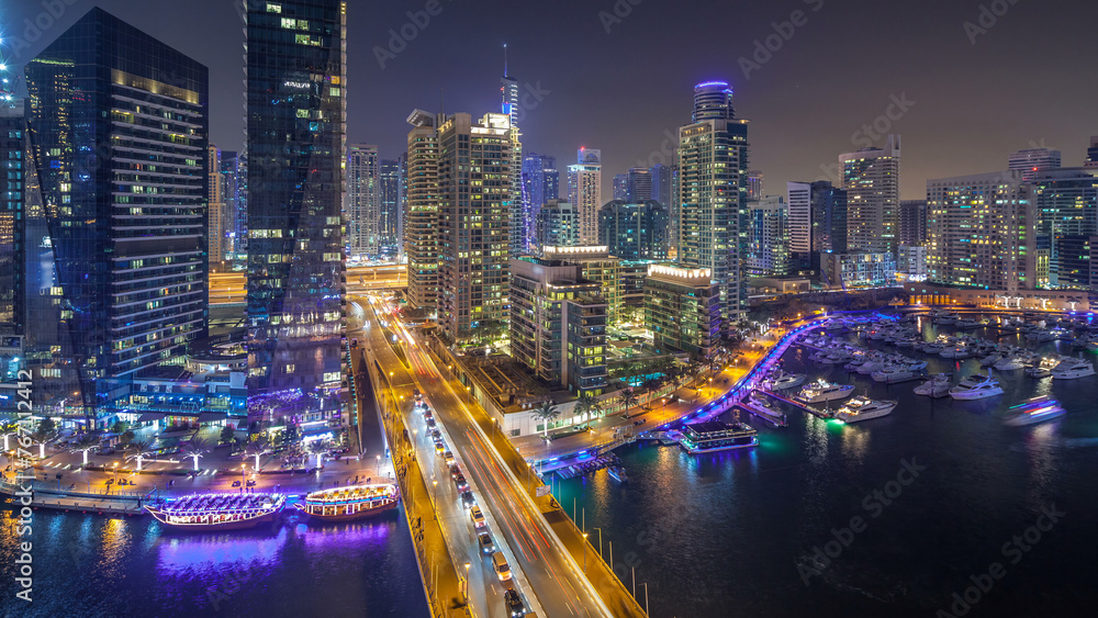 Water canal on Dubai Marina skyline at night timelapse.