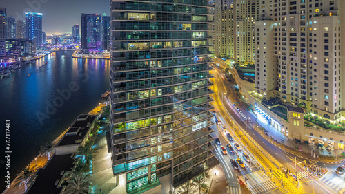 Night illumination of Dubai Marina aerial timelapse, UAE. photo