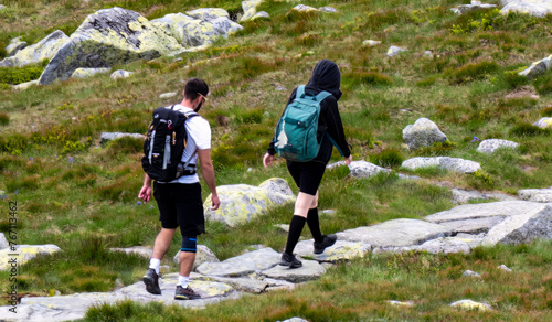 Tourists enjoy walking along the crest of the high mountain Chop