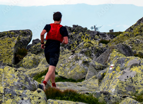 A young athlete enjoys running on the crest of the Chopok mounta