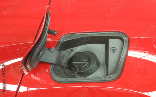 Open fuel tank door on car for fueling gasoline or diesel open. Transportation industry concept  