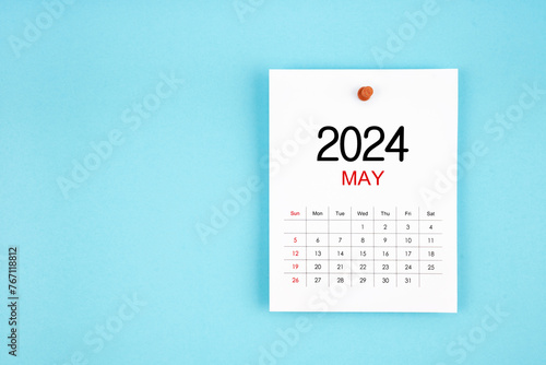 May 2024 calendar page with push pin on blue background.