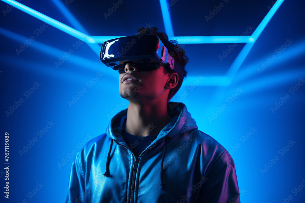 Portrait of man wearing virtual reality glasses. Neon background. Future technologies. 3d reality. Portrait of man wearing virtual reality glasses. Neon background. Future technologies. 3d reality.