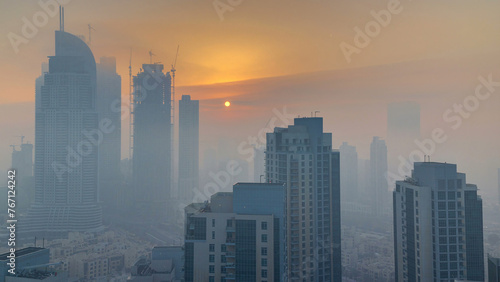 Foggy morning sunrise in downtown of Dubai timelapse.