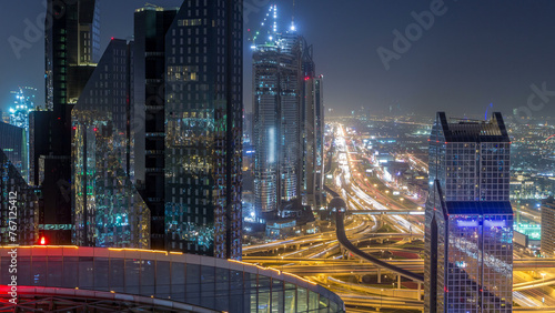Dubai downtown skyline night timelapse and Sheikh Zayed road traffic, UAE