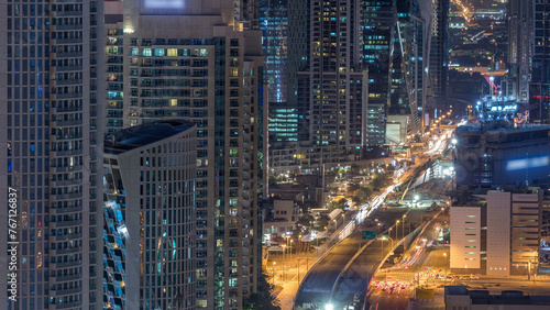Dubai Downtown night timelapse modern towers view from the top in Dubai, United Arab Emirates. © neiezhmakov