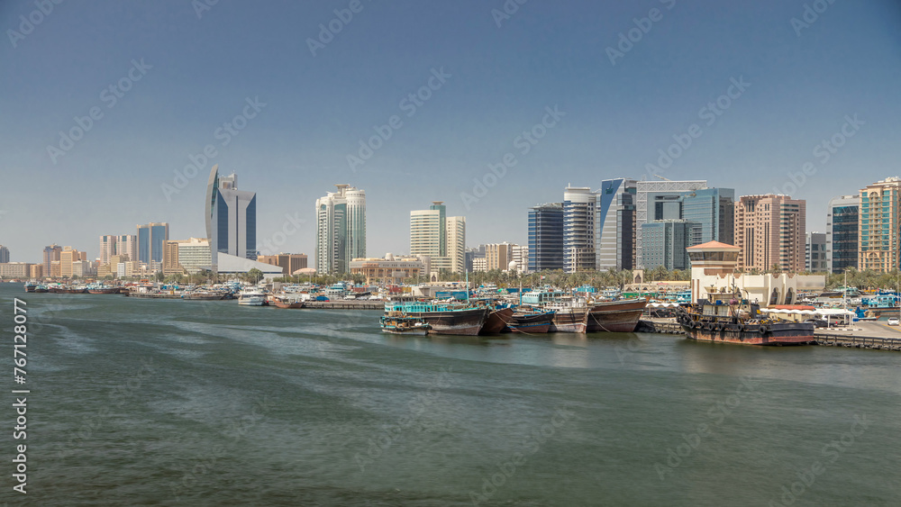 Obraz premium Trading wooden boats in the port timelapse. Merchant ships on the Creek Canal.