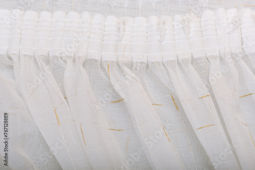Frills of white fabric. Flounces and ruffles of delicate curtains.