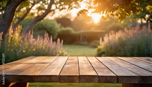 empty wooden table across summer time in backyard garden