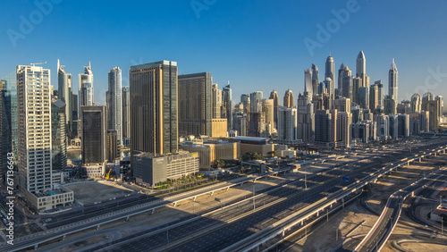 Dubai Marina skyscrapers aerial top view at morning from JLT in Dubai timelapse, UAE. © neiezhmakov
