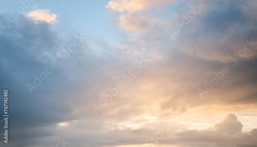composition of glowing light on grey and blue clouds background © Kristopher