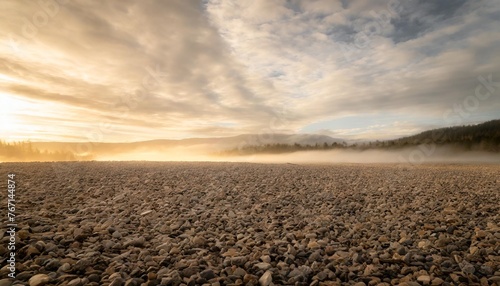 beautiful gravel background with gravel mist and clouds © Aedan