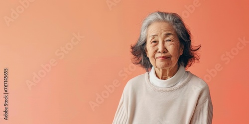 Serene Elderly East Asian Woman Portrait © Аrtranq