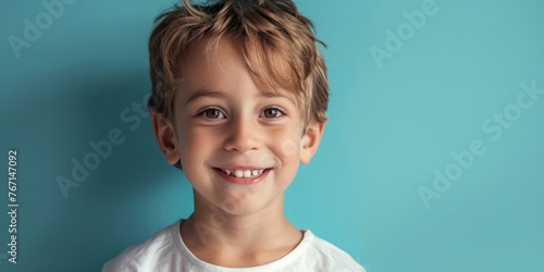 Smiling European Boy on Blue Background