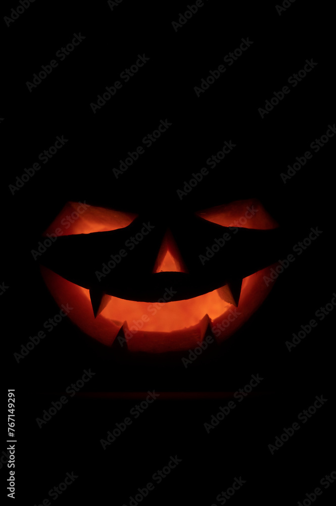 Face of a jack-o-lantern in the darkness Face of a jack-o-lantern in the darkness