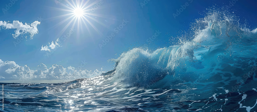 Sunlit ocean wave with clear blue sky