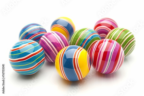 A bunch of colorful striped balls are scattered across a white background. The balls are of various sizes and colors, creating a vibrant and playful atmosphere. Concept of fun and joy