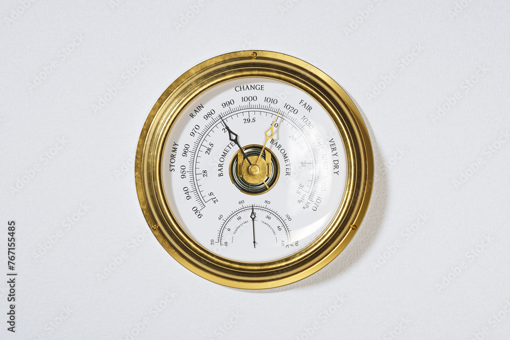 Elegant Antique Gold Barometer Against a Pristine White Background Elegant Antique Gold Barometer Against a Pristine White Background
