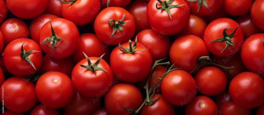 A stack of plum tomatoes, a type of fruit and vegetable, are piled on a table. They are natural foods and a staple ingredient in many dishes, often used as a whole food