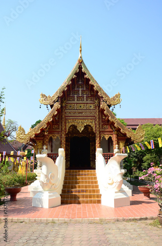 Ancient antique Ubosot Wihan Kaew for thai travelers people travel visit respect praying blessing buddha wish myth holy at Wat Phra Singh or Phra Sing temple at Chiangrai city in Chiang Rai, Thailand