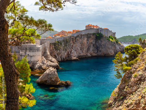 Dubrovnik Old town with turquoise water bay on Adriatic sea, Dalmatia, Croatia. Medieval fortress on the sea coast. Popular travel destination. Travel background