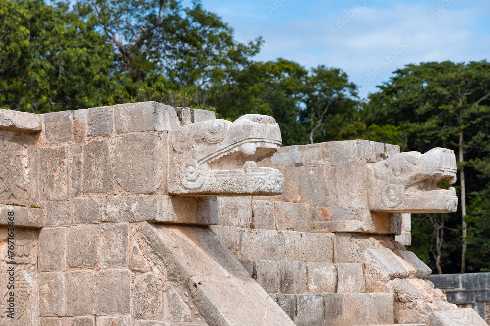 Two large snake heads carved from stone at the ancient Mayan ruins at Chichen Itza, Mexico.