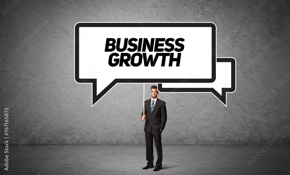 business person in casual holding road sign business person in casual holding road sign