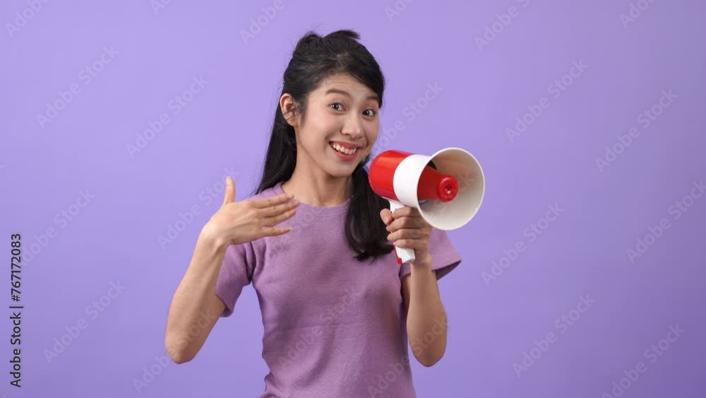 Young Asian woman holding mega phone to announce Young Asian woman holding mega phone to announce