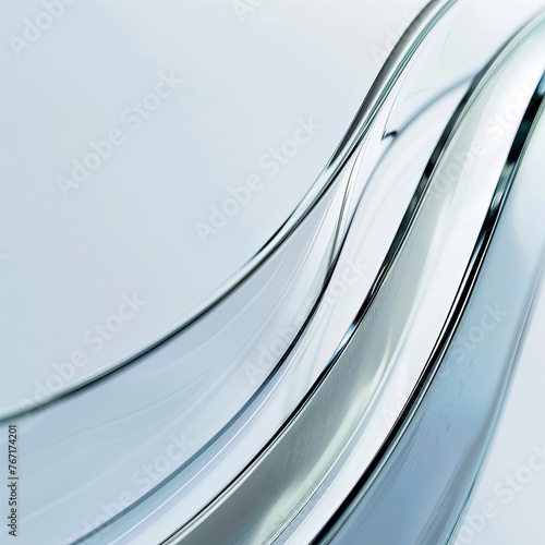 Closeup of the edge of an abstract, curved glass product with a light blue background, featuring a gradient from white to silver and a soft focus effect. 