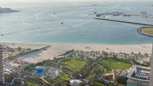 Aerial view of modern skyscrapers and beach at Jumeirah Beach Residence JBR timelapse in Dubai, UAE #767186683