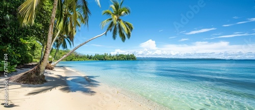 A Clear blue waters meet a serene sandy beach