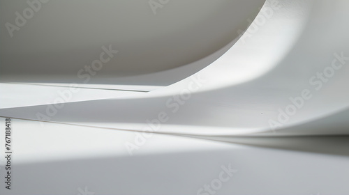 A white sheet of paper is folded in the shape of an S-shaped curve, with a light gray background and minimalist style. The curved edges create a sense of dynamism.