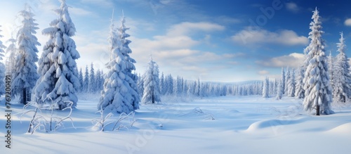 A winter wonderland where trees are blanketed in snow, under a clear blue sky. The freezing temperatures create a picturesque natural landscape, like a painting