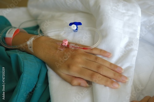 A needle that is placed in the patient's hand for infusion flow. IV drip transfusion photo