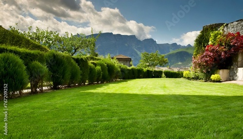 Landscape in summer with a green manicured lawn © Ümit