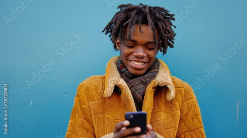 Man With Dreadlocks Using Cell Phone