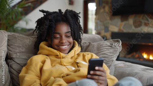 Smiling Woman With Dreadlocks Using Cell Phone