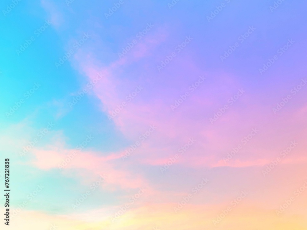 Bright pastel gradations of green, yellow, Pink, purple, cyan, and gently orange there is a subtle and combination on the atmospheric background of the sky with softly faded white clouds. Bright pastel gradations of green, yellow, Pink, purple, cyan, and gently orange there is a subtle and combination on the atmospheric background of the sky with softly faded white clouds.
