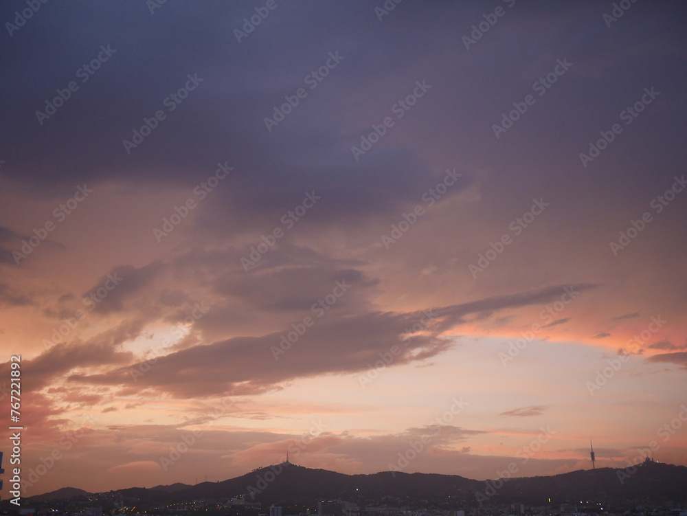 Pastel-colored sunset over the mountain of Barcelona