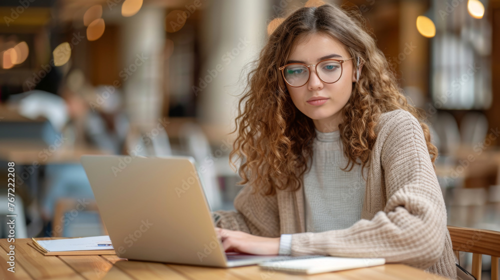 A professional woman is analyzing data on a computer screen in a modern office. A professional woman is analyzing data on a computer screen in a modern office.