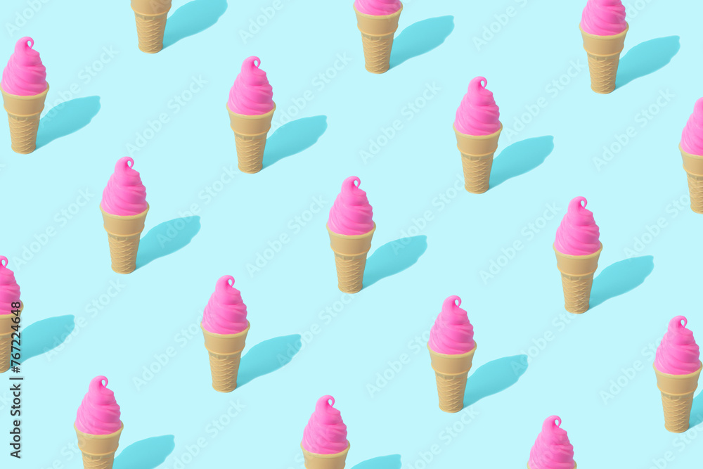 Trendy sunlight summer pattern made with pink ice cream on bright light blue background. Minimal summer concept. Trendy sunlight summer pattern made with pink ice cream on bright light blue background. Minimal summer concept.