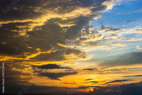 sunset sky with multicolor clouds. Dramatic twilight sky background